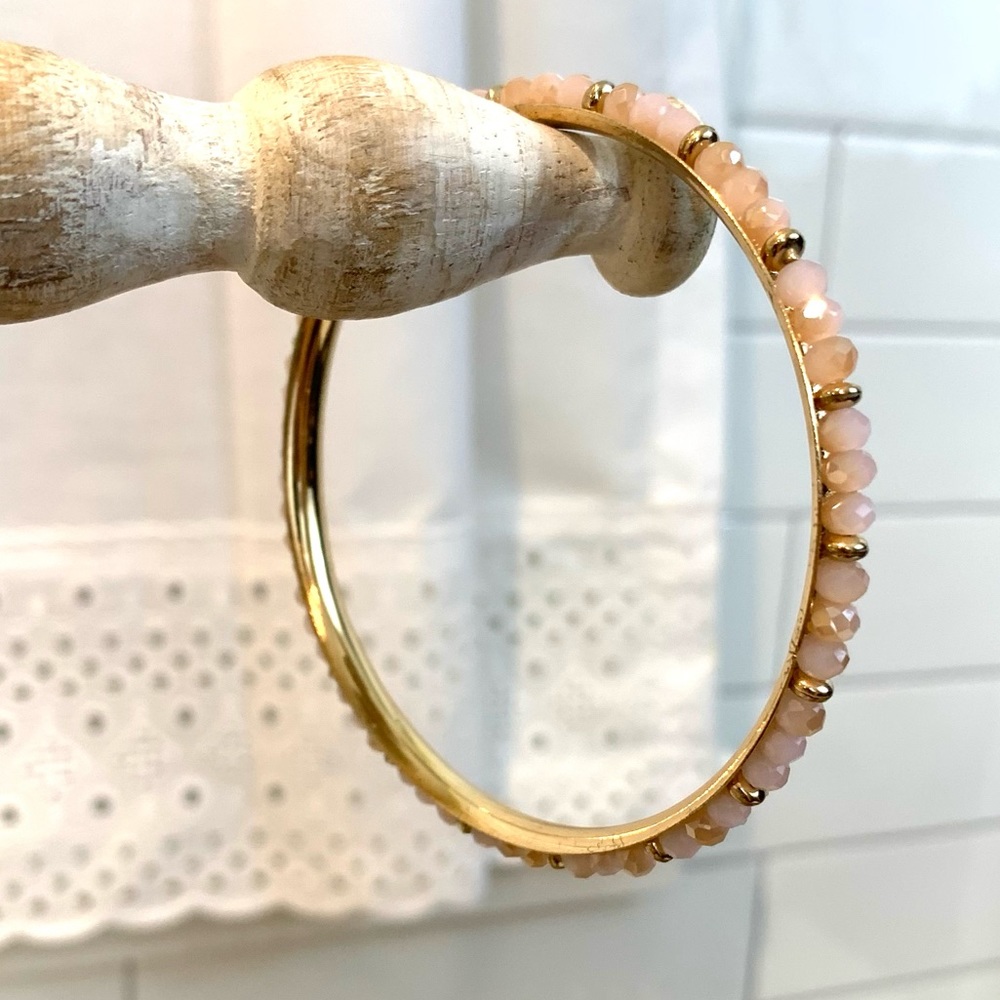 Gold tone bracelet bangle with pink beads